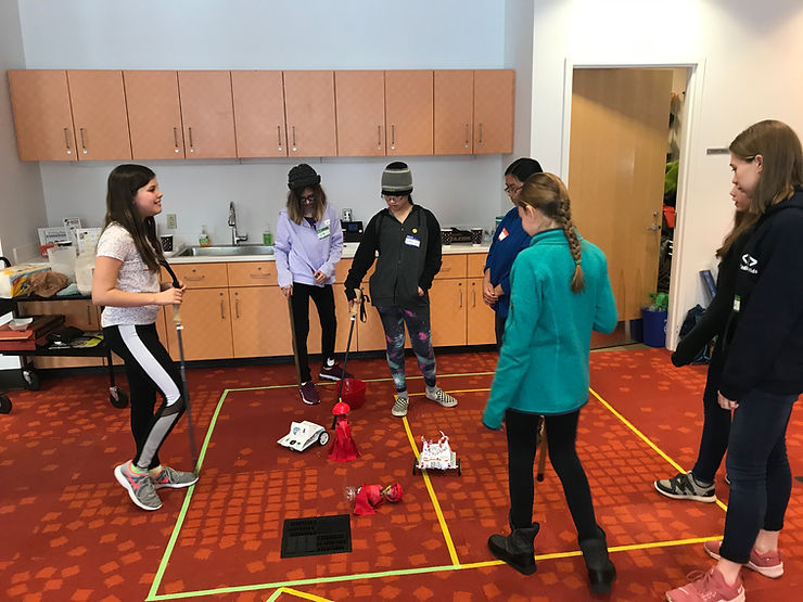 Campers learning and playing