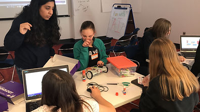 A team of campers coding and building their smart car