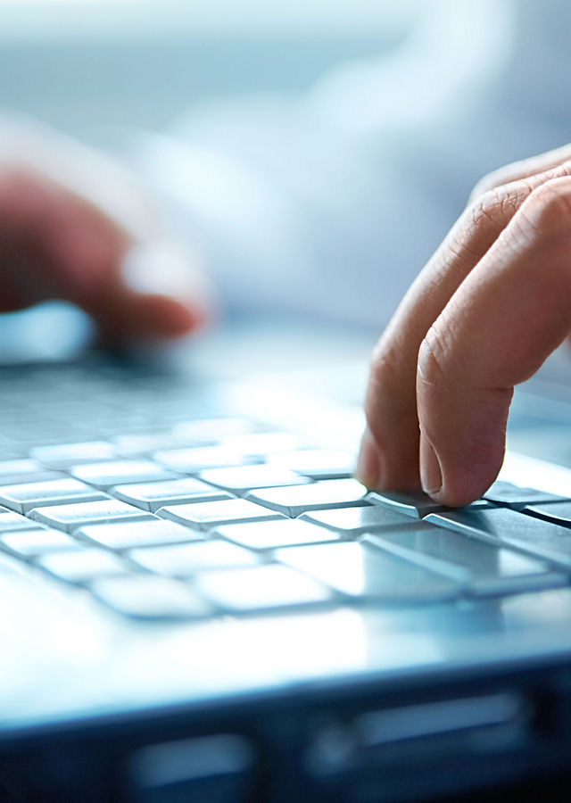 Hands on a computer keyboard